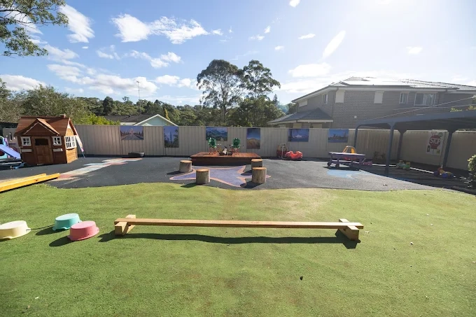 eastwood blessings child care exterior with balance beam and play area